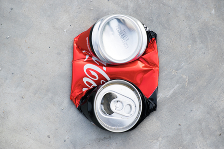 BANGSAN, THAILAND - november, 2017 Thai coke cans red color on street before being recycled.のeditorial素材