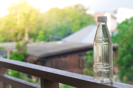Bottle water made to plastic on sky and tree blurry background.Using wallpaper for package or product, refreshing image and copy space.の写真素材