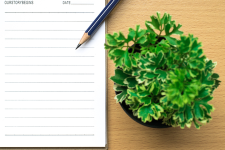 Notepad on tree blurry on wood background.using wallpaper for education, business photo.Take note of the product for book with paper and concept, object or copy space.の写真素材