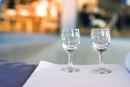 Notepad with wine glass on blurry background. using wallpaper or background for education, business photo. Take note of the product for book with paper and concept or copy space.の写真素材