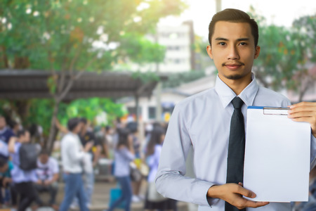 This career saleman or business man inspection writing on notepad or book, paper with building and...