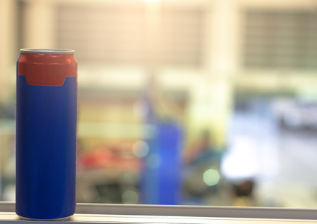 Blue can Coca Cola for drinks to refresh on blurred background For 
advertising of drinks imageの写真素材