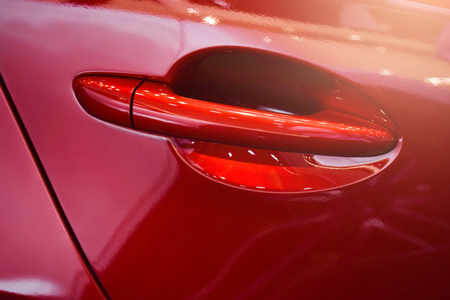 Close up red car door with smart keyless For automotive or transportation imageの写真素材