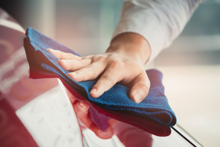 Man asian inspection and cleaning Equipment car wash With red car For cleaning to quality to customer on car showroom of service transport automobile transportation automotive image.の写真素材