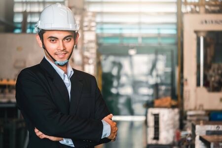 Asian engineer factory inspection with man business engineer in industry we wears a helmet male...