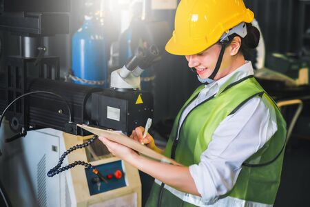 female note writing clipboard engineer factory inspection with robot ai machine assist production...