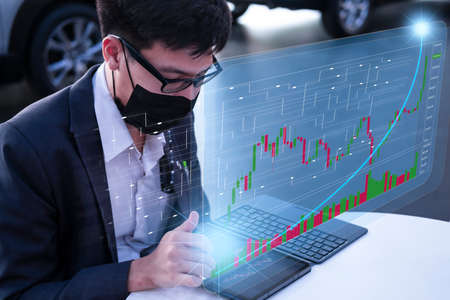 Asian man business holding tecnology graph bitcoin. For business stock market finance, lifestyle and...