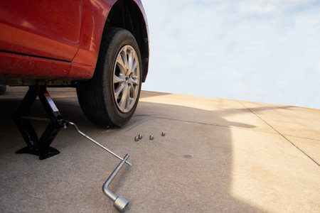 Red car in station repair service car maintenance for industry rubber wheels tire vehicle auto car change garage repairing problem transport automobile service automotive maintenanceの写真素材