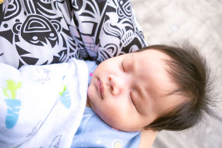 Asian mom carry infant or baby child babe child childhood so cute in home family Pictures for newborns, mothers and children.の写真素材