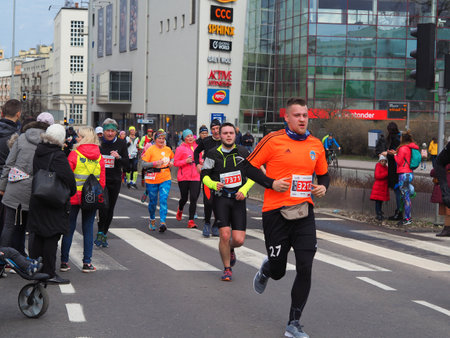 Gdynia / Poland-March 17.2019 Runners on the route of the half marathon in Gdyniaのeditorial素材