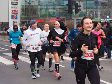 Gdynia / Poland-March 17.2019 Runners on the route of the half marathon in Gdyniaのeditorial素材