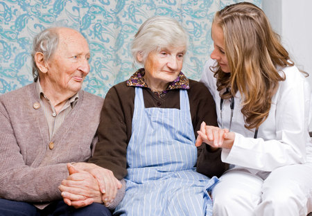 Old couple at the young doctorの写真素材