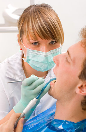 Young man at the sweet dentistの写真素材