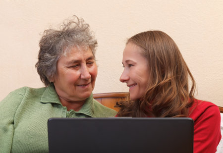 Mother and her daughter surfing on the internet 