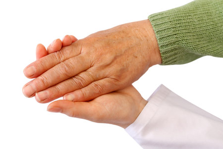 Old woman's hand on white isolated backgroundの写真素材