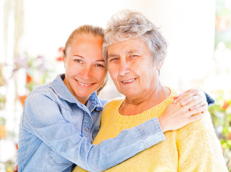 Elderly woman and her daughter enjoying themselvesの写真素材