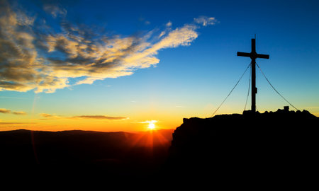 Watching the sundown on the top of mountainsの写真素材