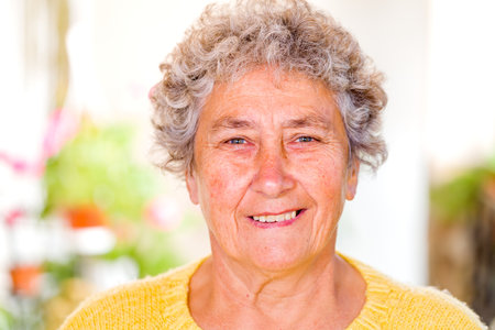 Portrait of an elderly woman smiling at the camera