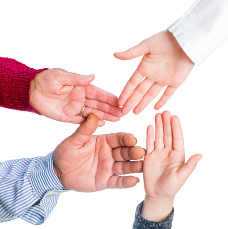 Close up photo of many hands together
