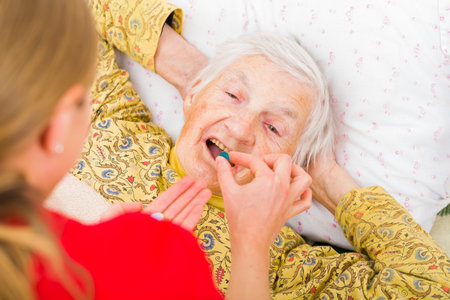 Photo of elderly woman taking the medicationの写真素材