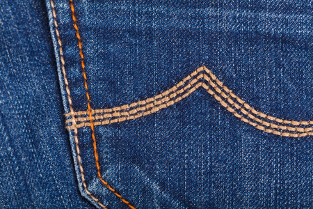 Close up photo of blue jeans pocket