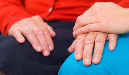 Young doctor giving helping hands for elderly womanの写真素材