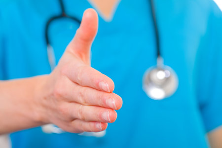 Close up photo of handshake gesture from doctorの写真素材