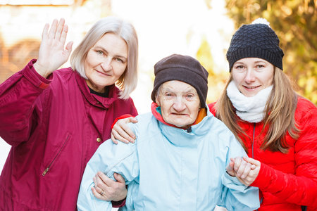Photo of elderly woman and her carersの写真素材
