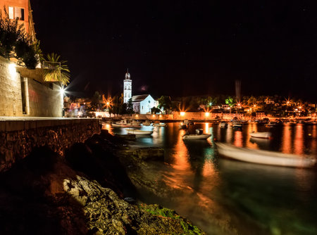 Landscape photo of mediterranean town at nightの写真素材