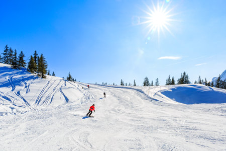 Snowy winter landscape of a ski resort in the Alpsの写真素材