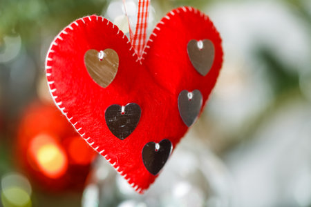 Close up photo of hanging red heart ornament