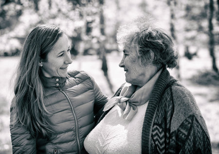 Photo of happy elderly woman with her daughterの写真素材