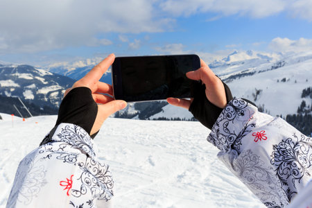 Young tourist taking photo with the smartphoneの写真素材