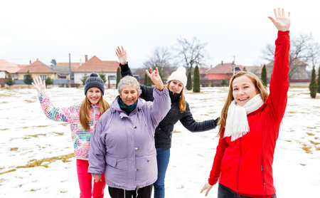 Photo of happy elderly woman and granddaughtersの写真素材