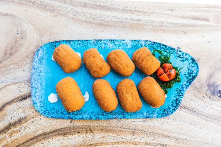 Blue croquette plate seen from aboveの写真素材