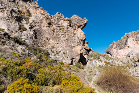 Great vertical wall in the mountains on the route of the Monachil river, in Los Cahorros, Granada, Spain.の写真素材