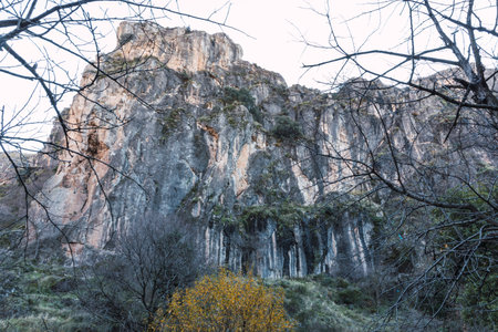 Great vertical wall in the mountains on the route of the Monachil river, in Los Cahorros, Granada, Spain.の写真素材