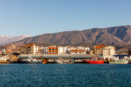 large ship moored in the commercial port with calm sea in motril, Andalucia Spainの写真素材