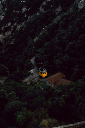 Yellow cable car over the mountains at the Monastery of Montserrat, Barcelona, Spain