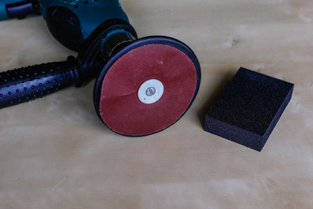 electric sandpaper on drill together with hand sandpaperの写真素材