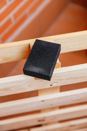 black hand sandpaper on pallet to fixの写真素材