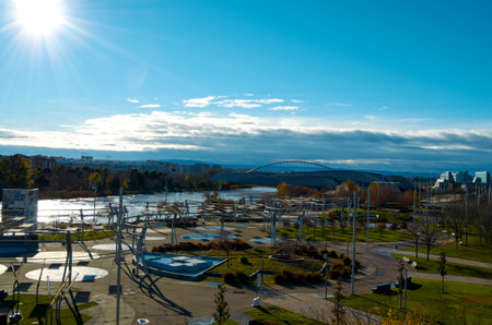 View of the Zaragoza Expo promenade with the Ebro river under the sun and blue sky.の写真素材