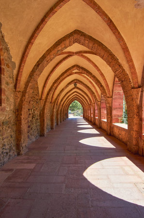 Corridor in the vaults of an abbey in the mountainsの写真素材