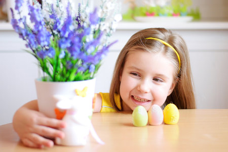 Happy smiling girl celebrate Easter at homeの写真素材