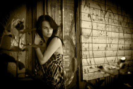 beautiful girl over wooden wallの写真素材