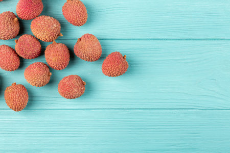 Lychee on a blue background, flat lay, copy spaceの写真素材
