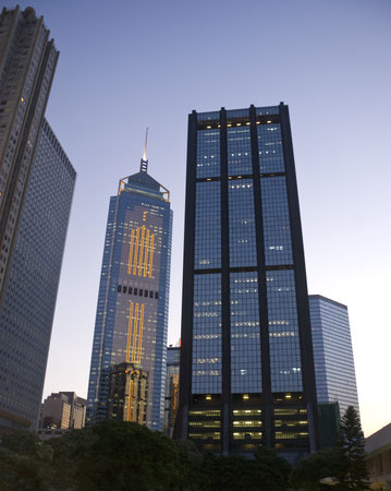 Downtown office buildings in Wan Chai, Hong Kong, in the late sunset before evening. Beautiful blue...