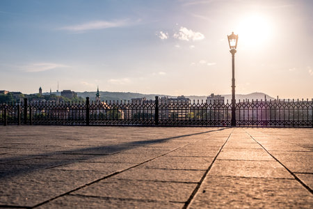 Sunset. Reflection of a lantern on the sidewalk. Danube Embankment in Budapestの写真素材