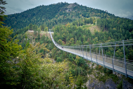 Suspension Bridge highline179 at Reutte between two hills in beautiful landscape Scenery of Alps, Tirol, Austriaの写真素材