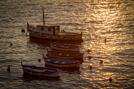 Fishing boats at sunset near the Cinque Terre Italy